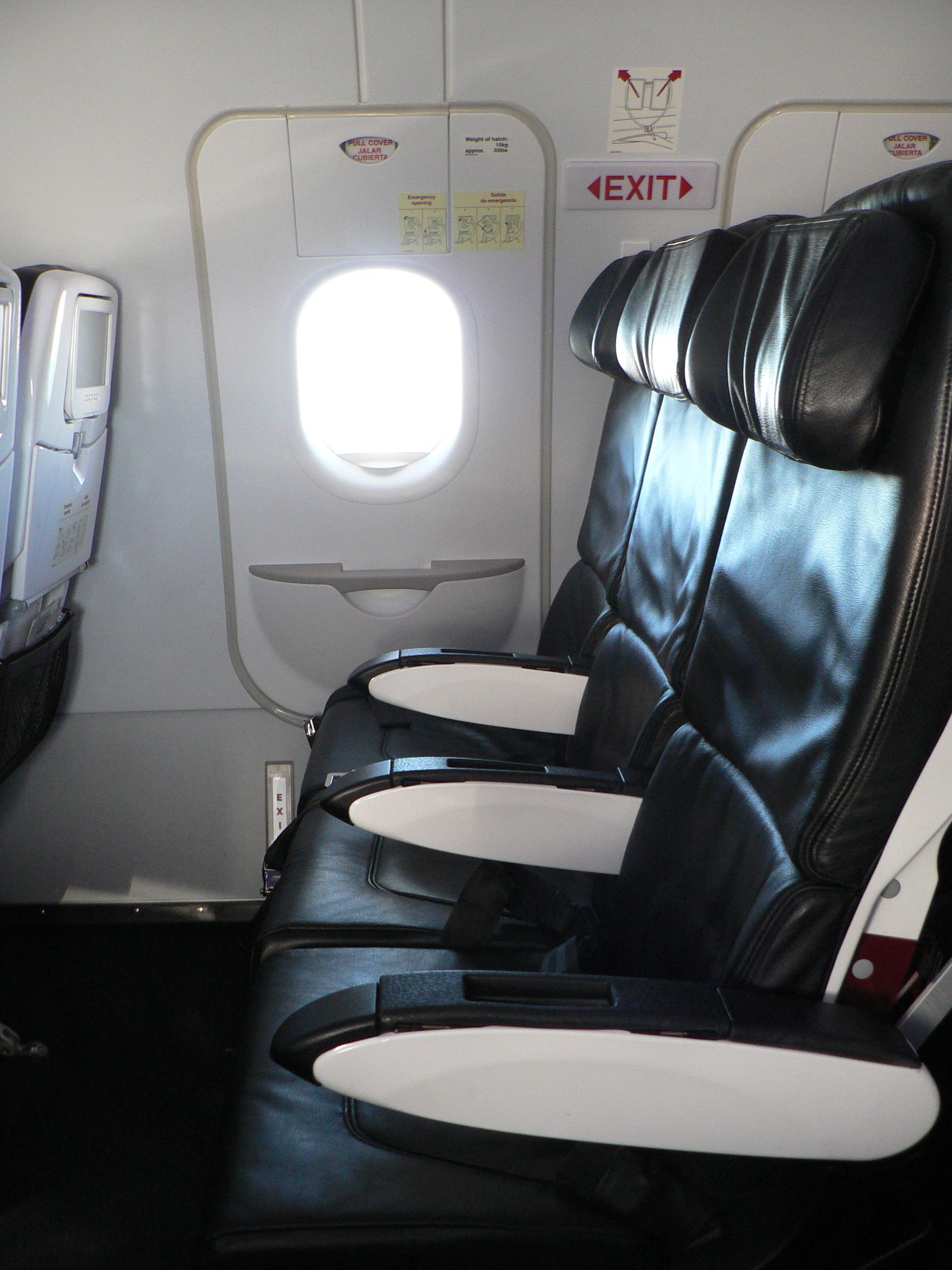 Emergency exit row with black seats